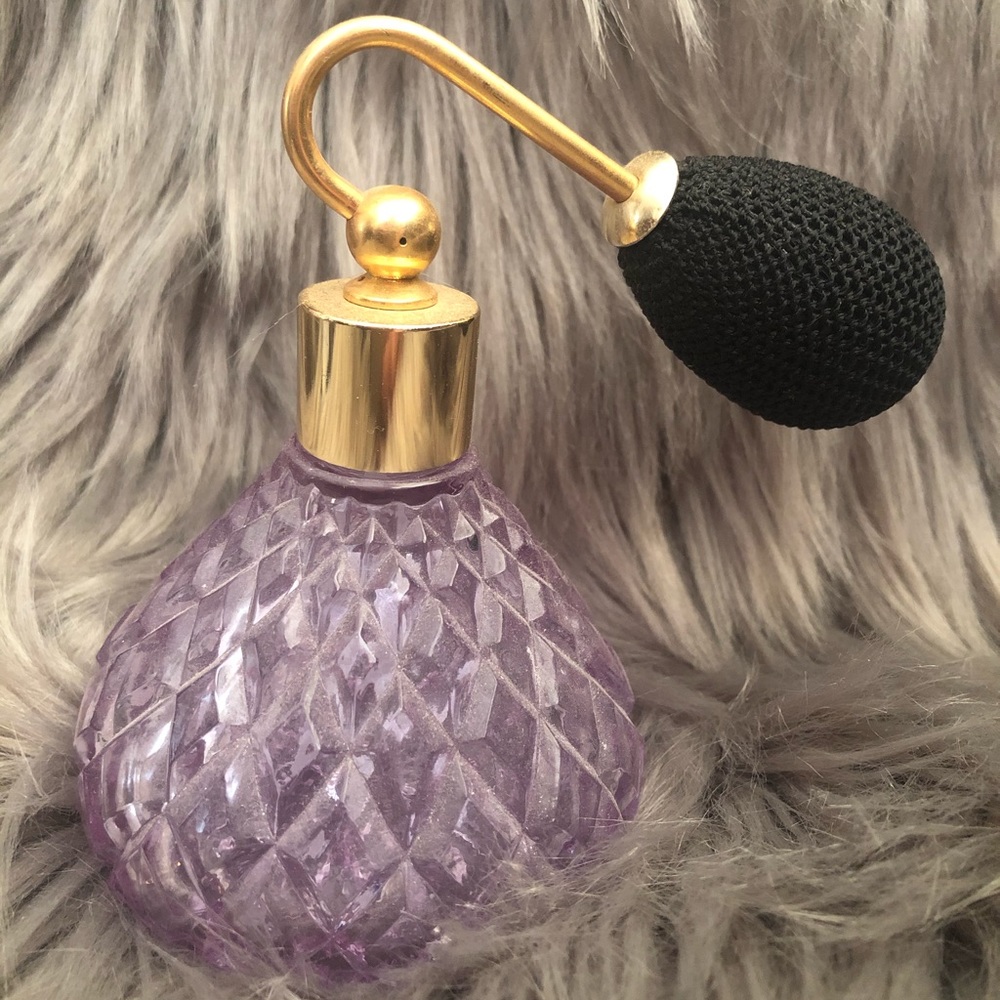 Vintage purple empty perfume spray with atomizer